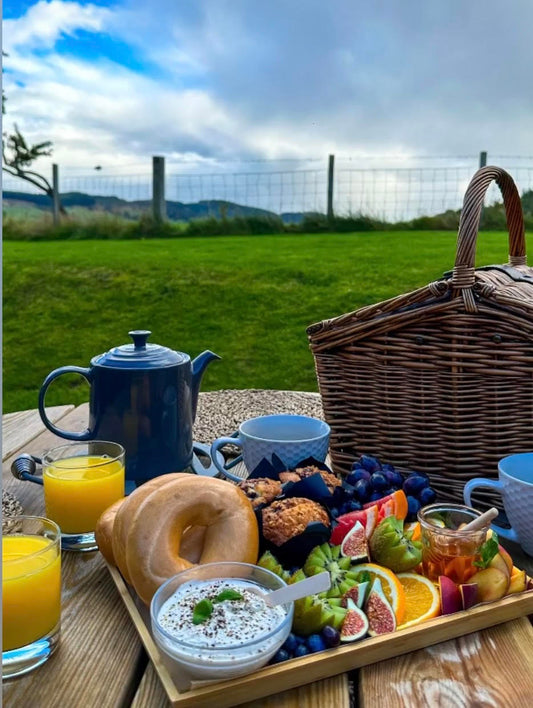 Breakfast Grazing Box. Filled with fresh fruit, bagels, soft cheese, fresh cakes or pastries. 
